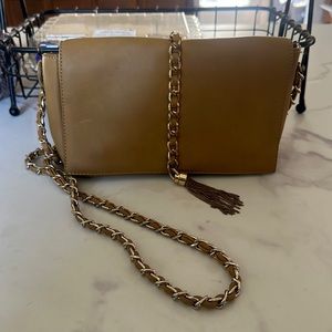 Small, over the shoulder purse. Dark yellow.